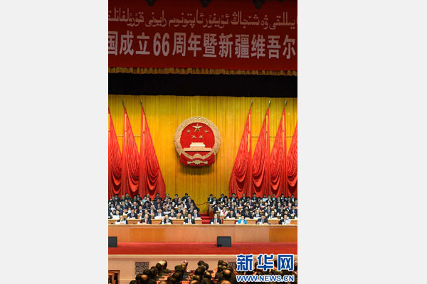 10月1日，慶祝中華人民共和國成立66周年暨新疆維吾爾自治區(qū)成立60周年大會(huì)在新疆人民會(huì)堂隆重舉行。 新華社記者 高潔 攝 